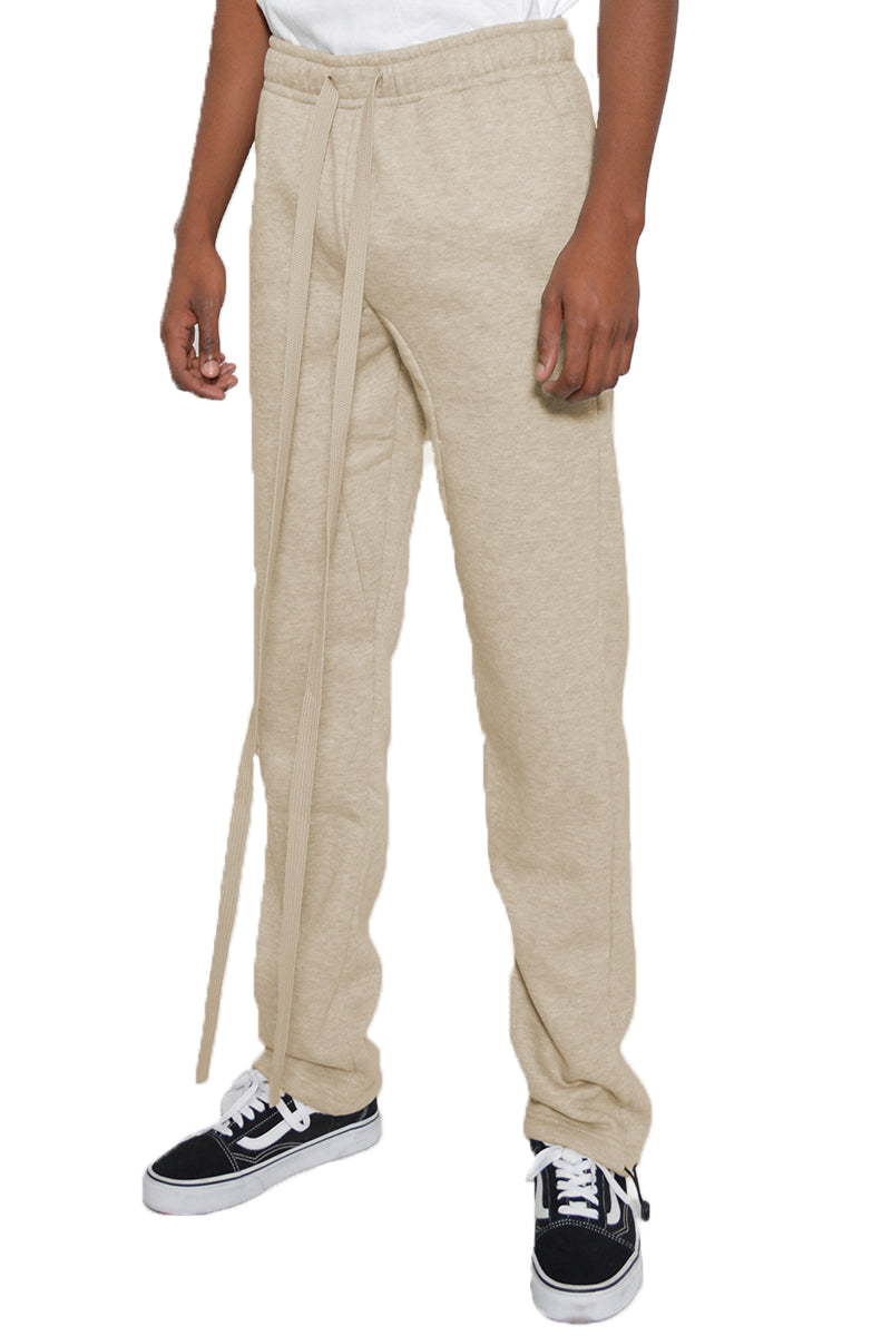 Beige pants with drawstring waist on a white background