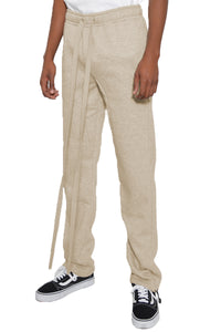Beige pants with drawstring waist on a white background